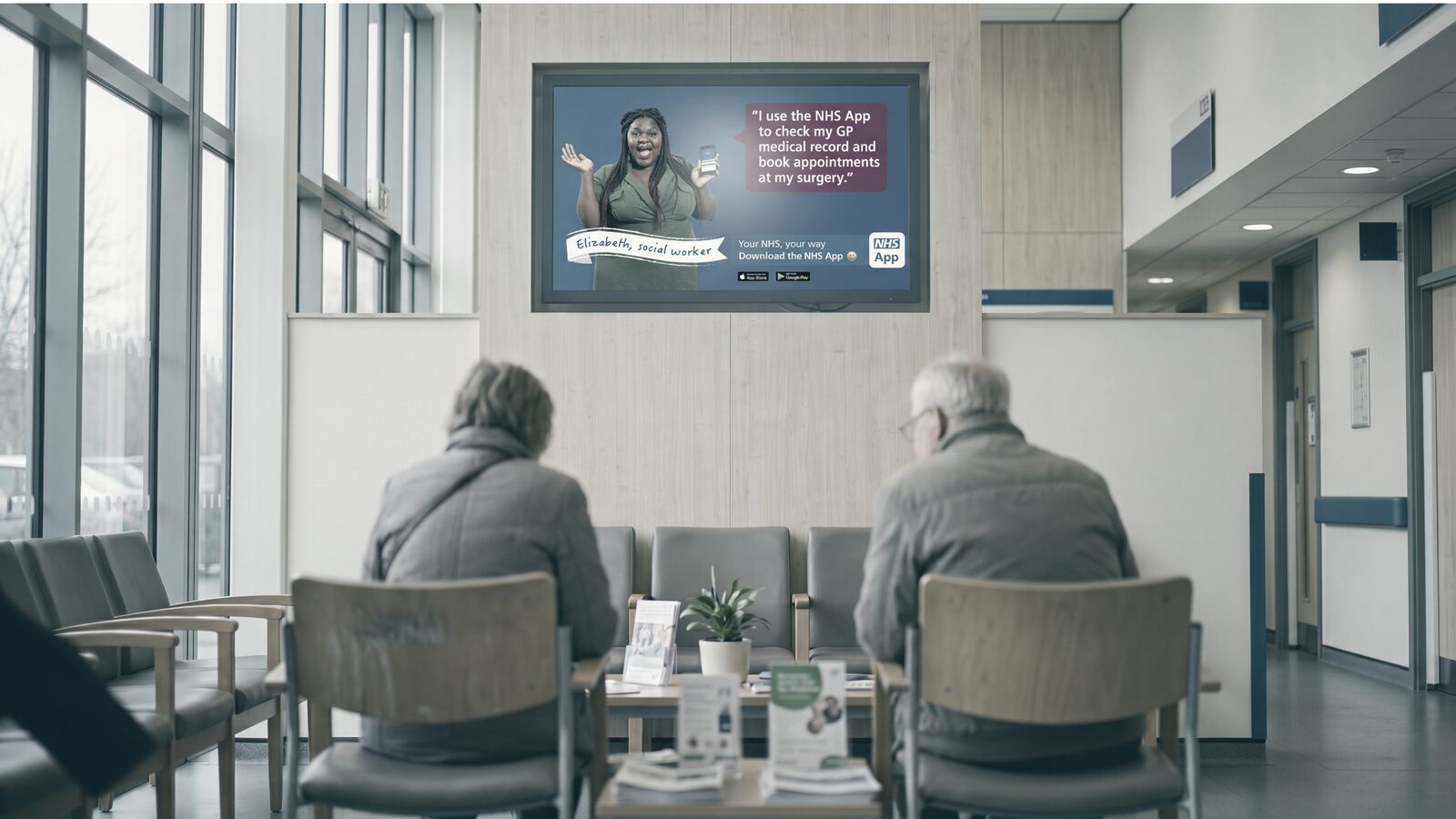Illustration of a waiting-room media display mounted in a GP surgery