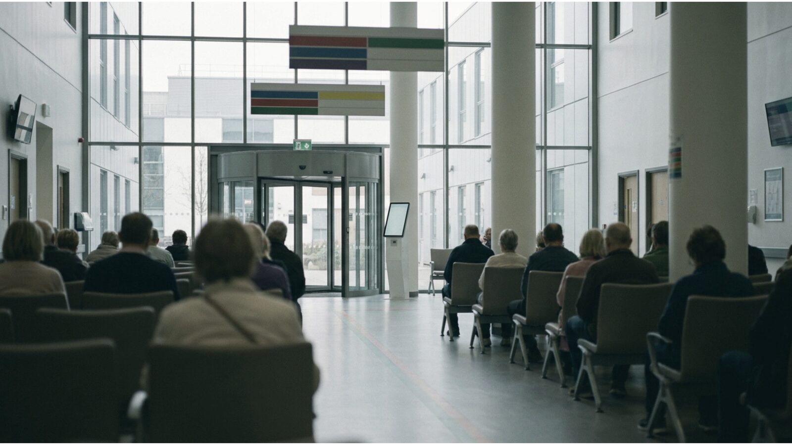 Illustration of a hospital outpatient waiting area with a check-in kiosk